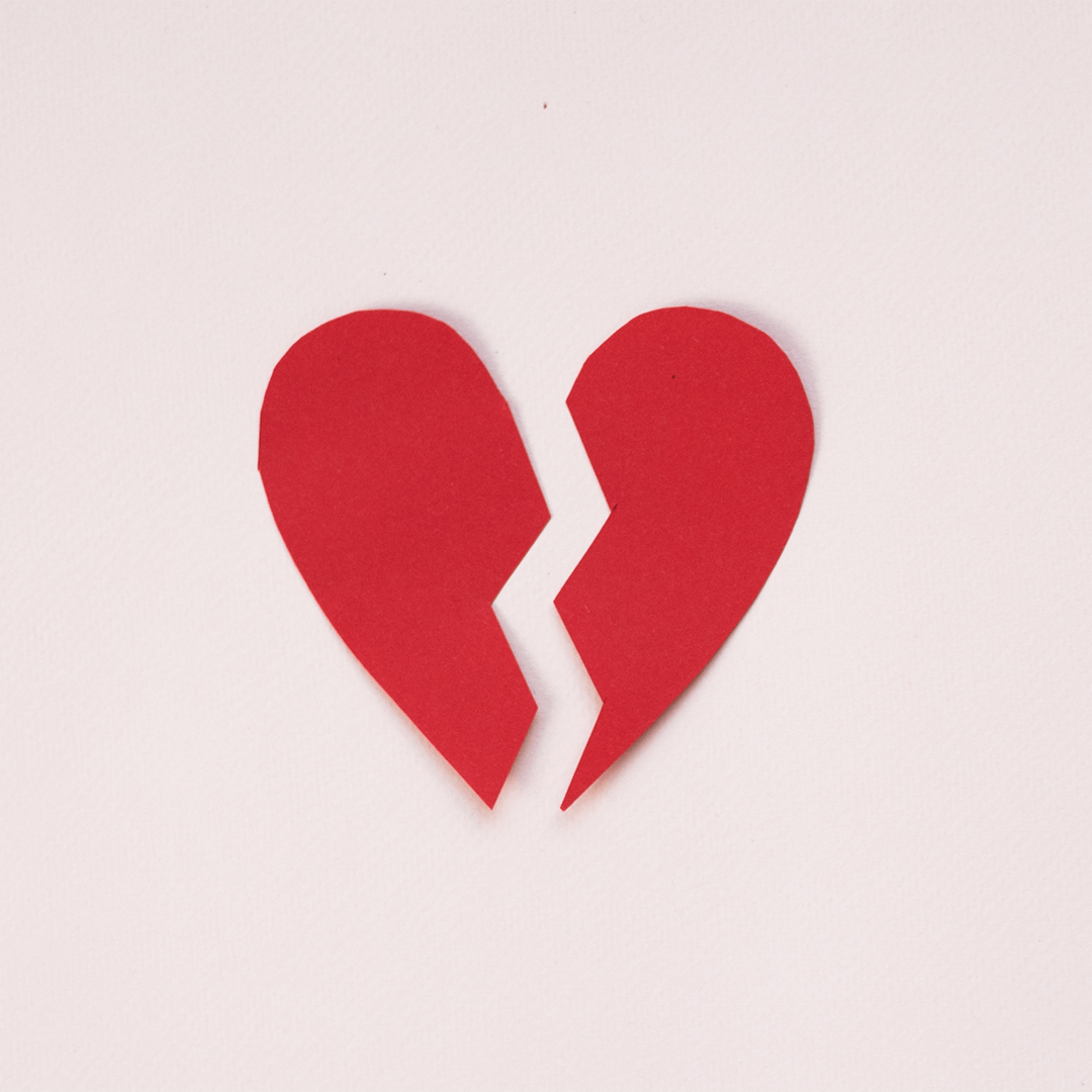 Picture of red heart shape broken in two