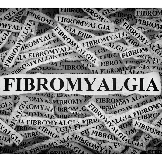Fibromyalgia on tiny scrapes of paper in black and white in a piled high 